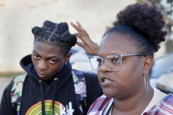 A Black student was suspended for his hairstyle. Now his family is